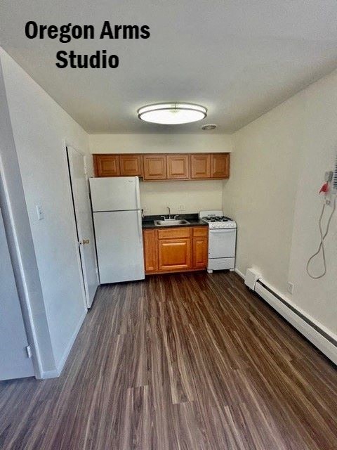 a kitchen with a stove and a refrigerator